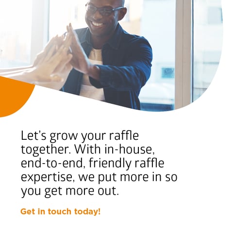 Image of young professional high fiving his team mates as they have grown their raffle with Woods Valldata