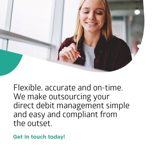 Young professional fundraise poised with pen getting on with raising more income while Woods Valldata take the hassle out of managing direct debits