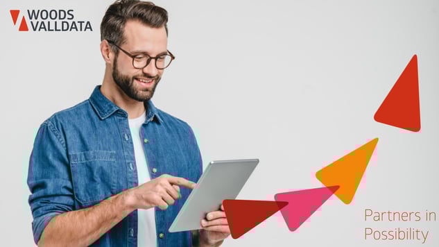 Young man with glasses and beard in Demin short holding a tablet banner WV brand