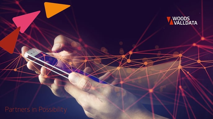 hands on black background holding a smart phone with an overlay of connected lines in red WV Branded